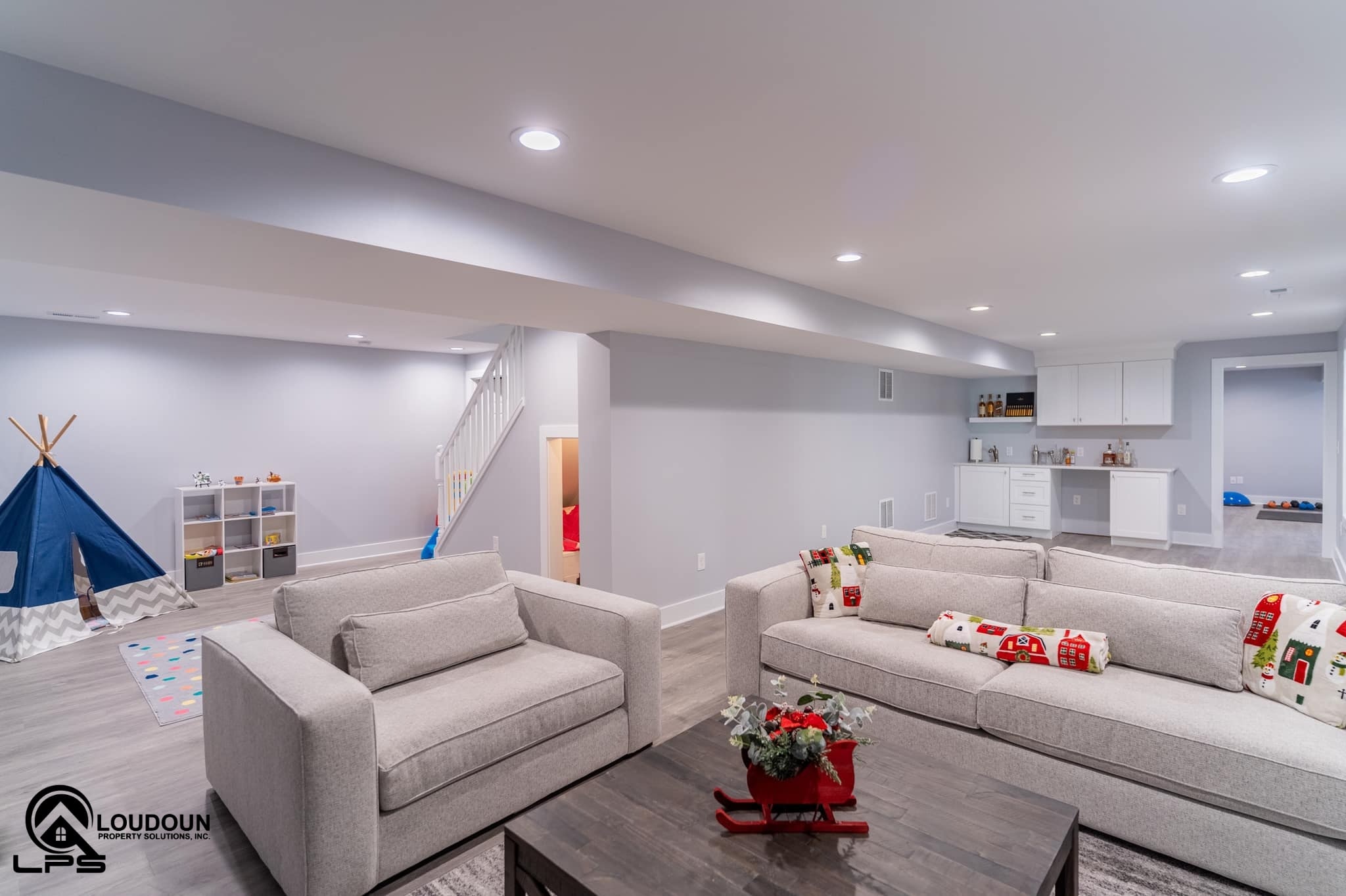 This renovated basement includes a family room, full bathroom, playroom, gym, wet-bar and under-stair storage.